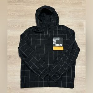 Black half-zip sweatshirt jacket. Has a sticker on the chest.